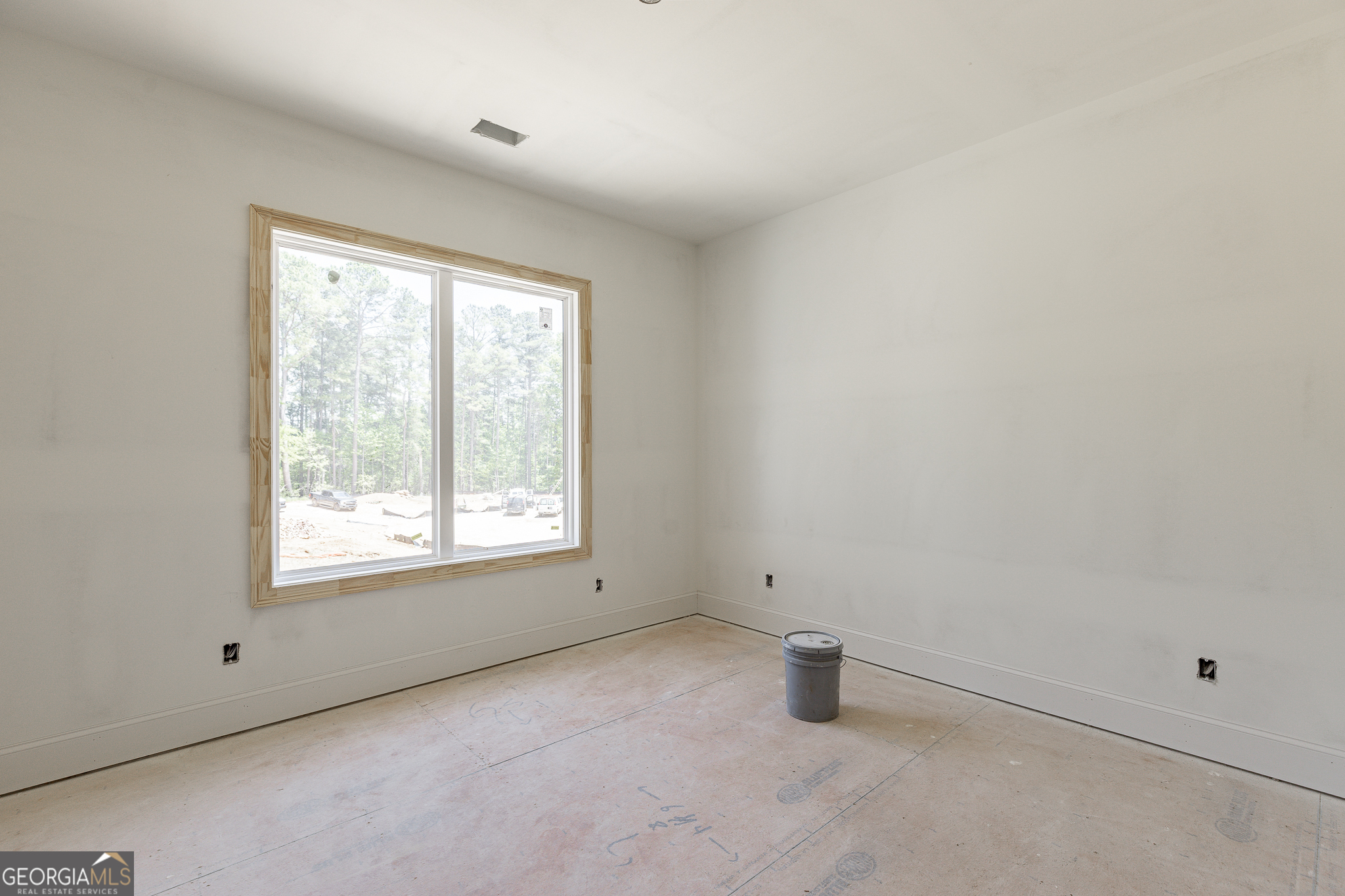 2969 North Bogan Road Northeast, Unit 1 Buford, GA 30519 - Photo 22 of 51 an empty room with a window