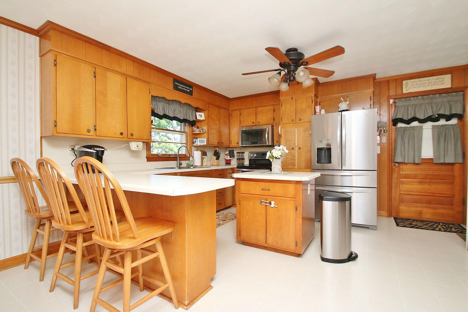 164 Standiford Road Union Hall, VA 24176 - Photo 17 of 40 a kitchen with stainless steel appliances granite countertop a sink a stove and a refrigerator