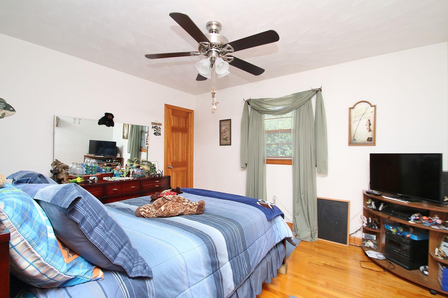 164 Standiford Road Union Hall, VA 24176 - Photo 20 of 40 a bedroom with a bed and a flat screen tv