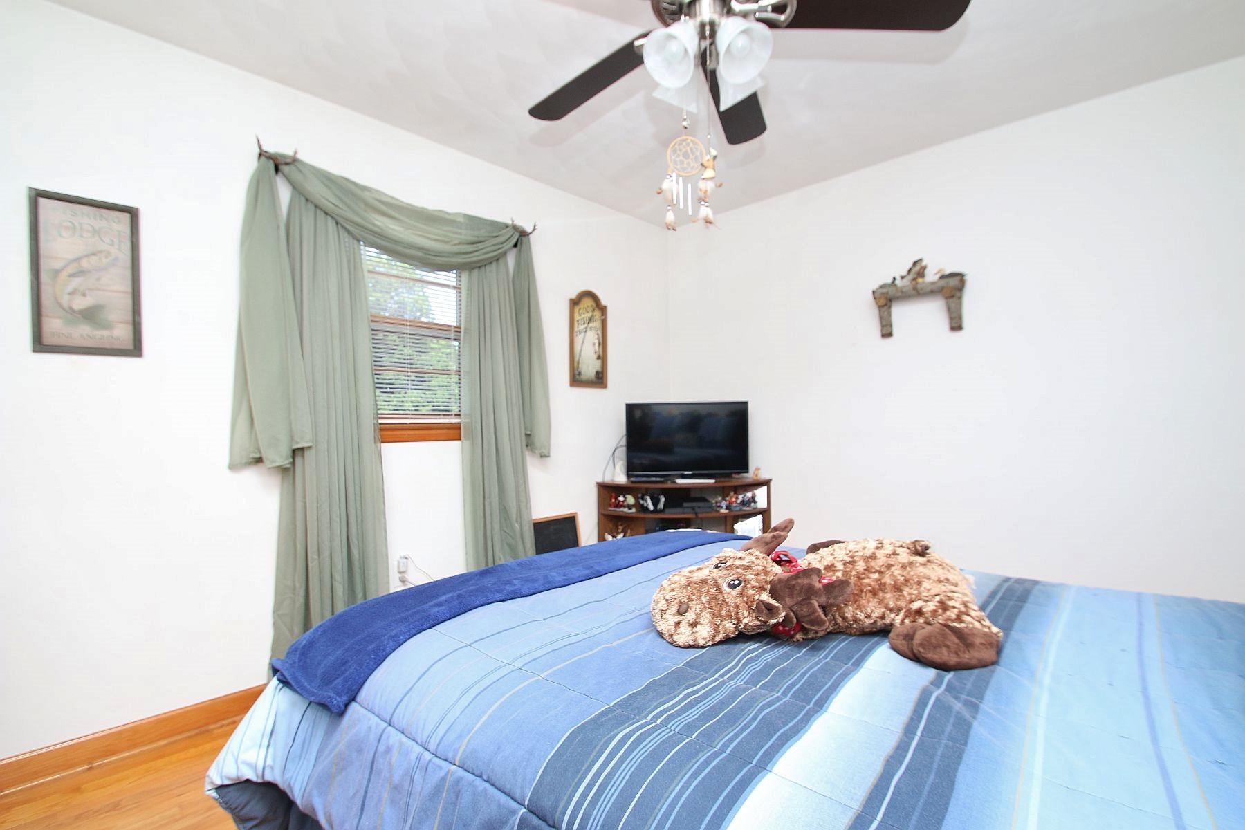 164 Standiford Road Union Hall, VA 24176 - Photo 21 of 40 a bedroom with furniture and a wooden floor