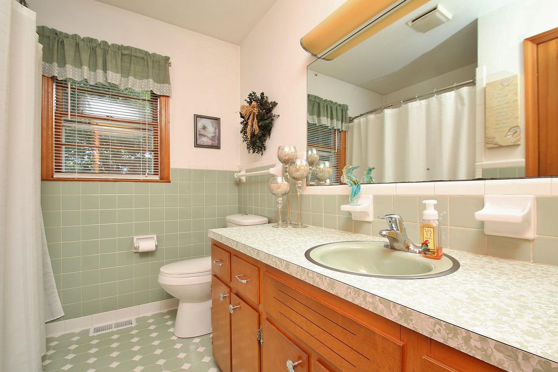 164 Standiford Road Union Hall, VA 24176 - Photo 22 of 40 a bathroom with a granite countertop sink toilet and shower