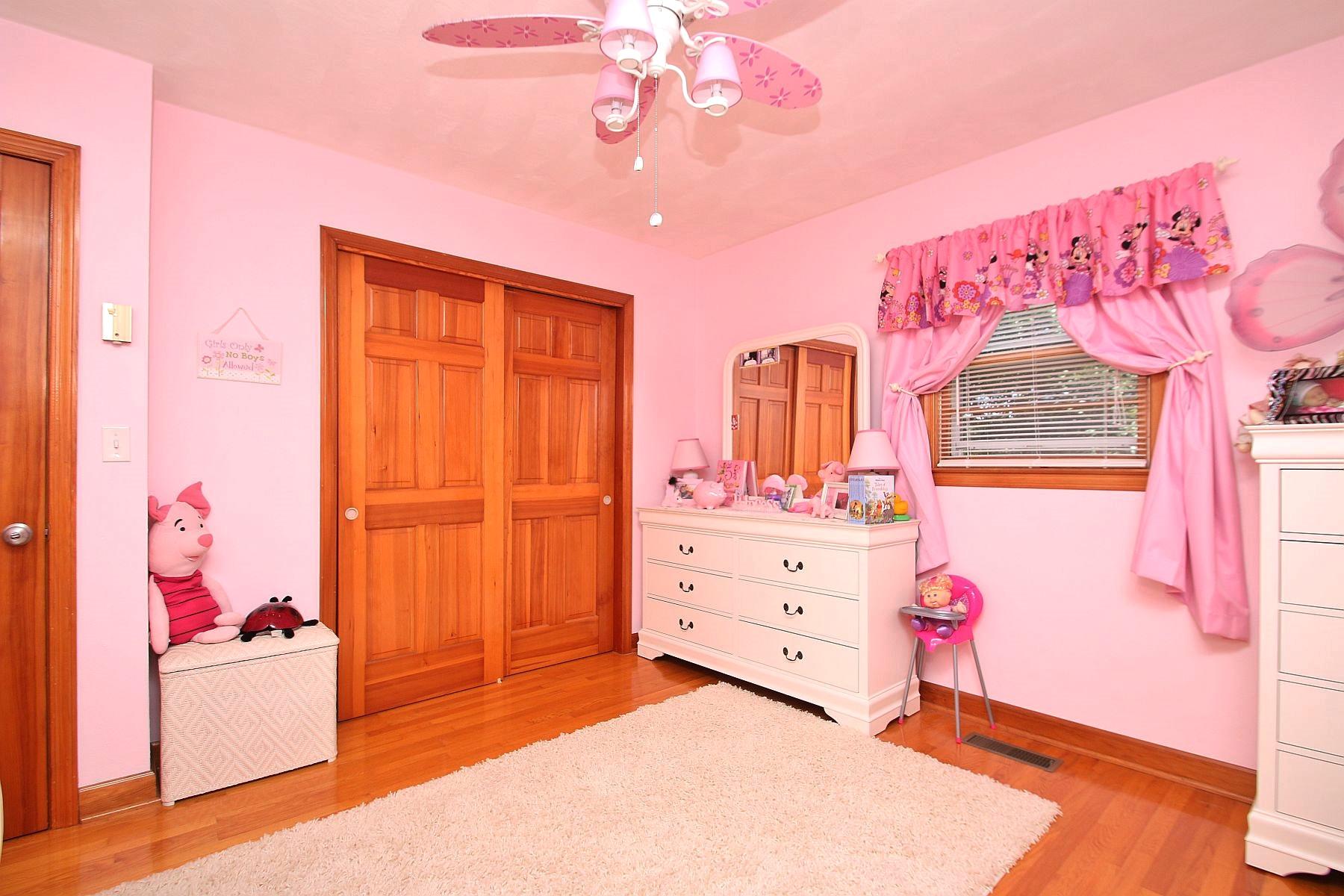 164 Standiford Road Union Hall, VA 24176 - Photo 25 of 40 a bedroom with a bed and a chandelier