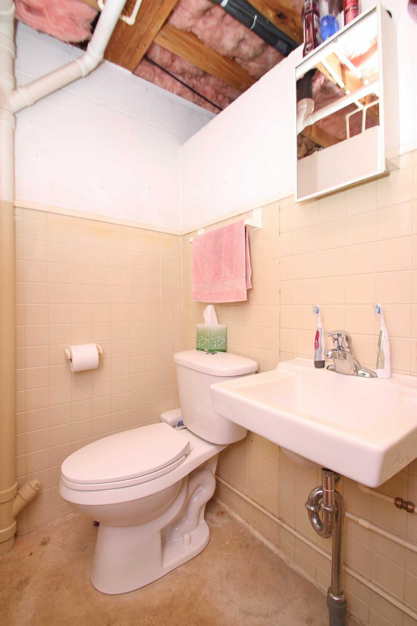 164 Standiford Road Union Hall, VA 24176 - Photo 27 of 40 a bathroom with a sink a toilet and mirror