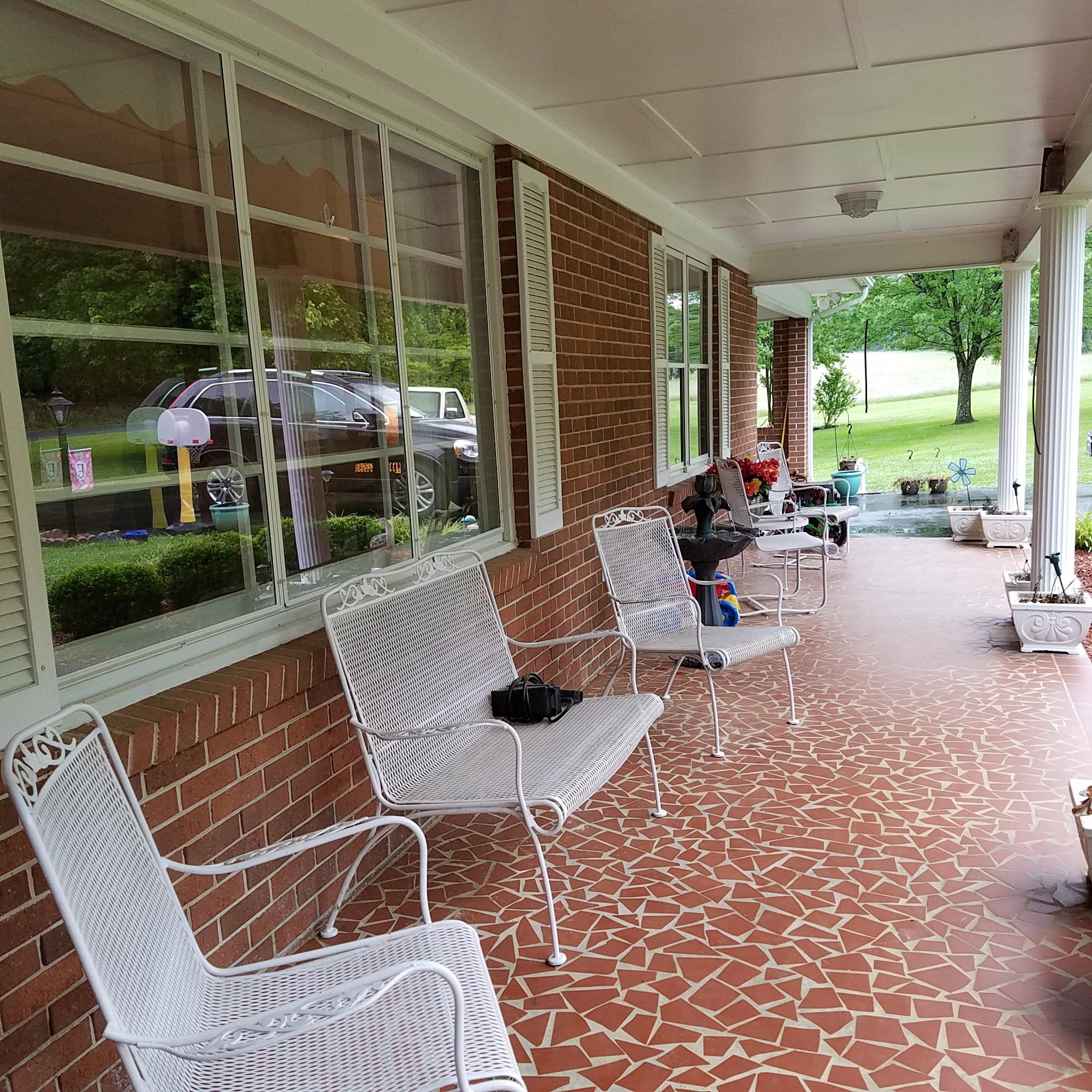 164 Standiford Road Union Hall, VA 24176 - Photo 4 of 40 a outdoor space with patio the couches and a dining table with garden view