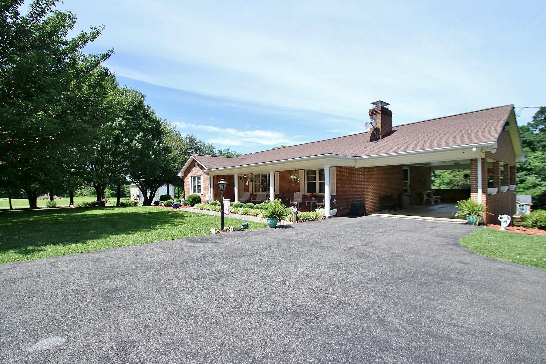 164 Standiford Road Union Hall, VA 24176 - Photo 33 of 40 a front view of a house with a yard and garden
