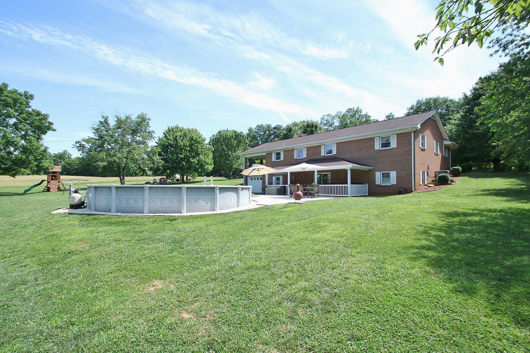 164 Standiford Road Union Hall, VA 24176 - Photo 35 of 40 a front view of a house with a yard table and chairs