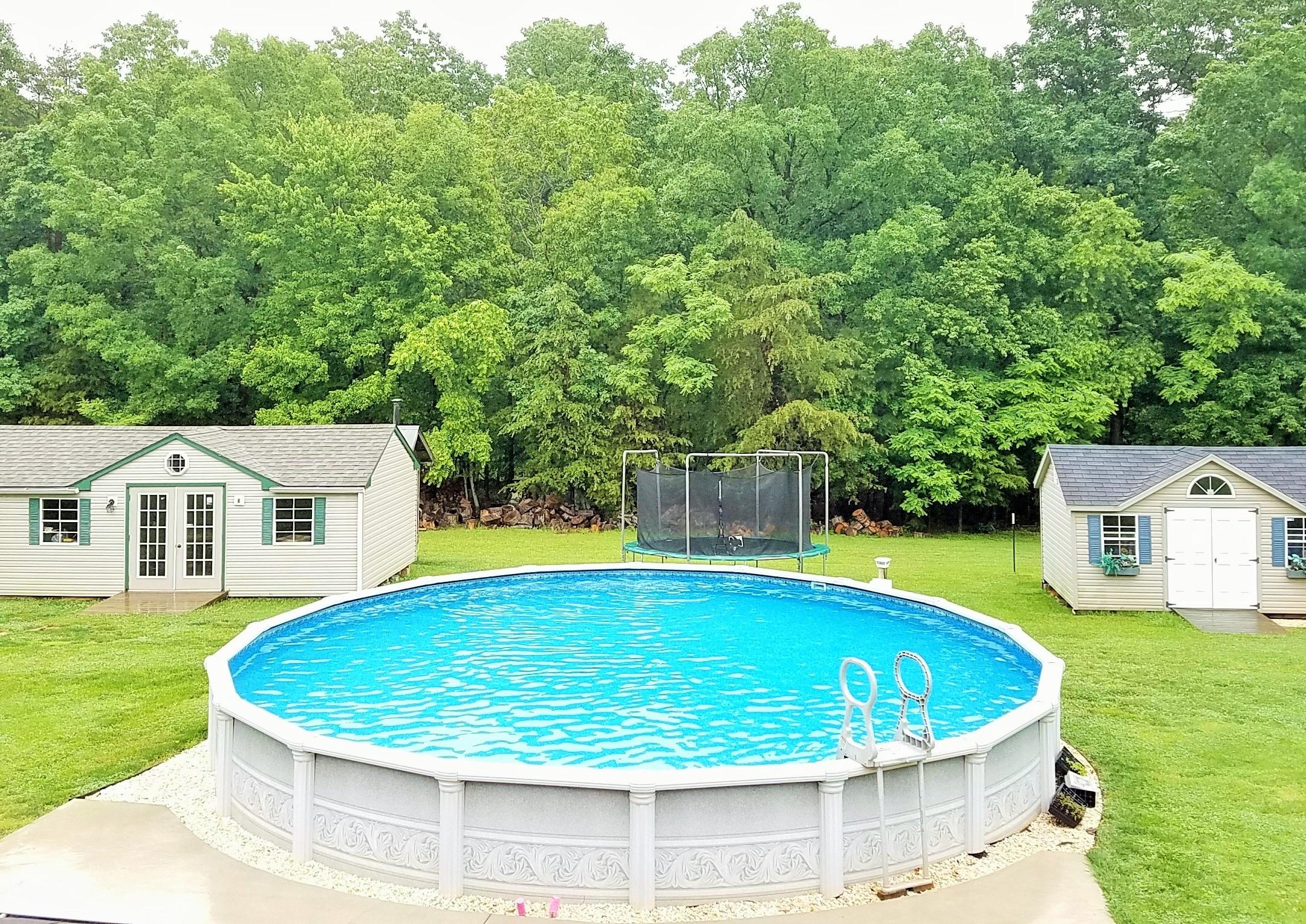 164 Standiford Road Union Hall, VA 24176 - Photo 10 of 40 a view of a house with a backyard and a swimming pool
