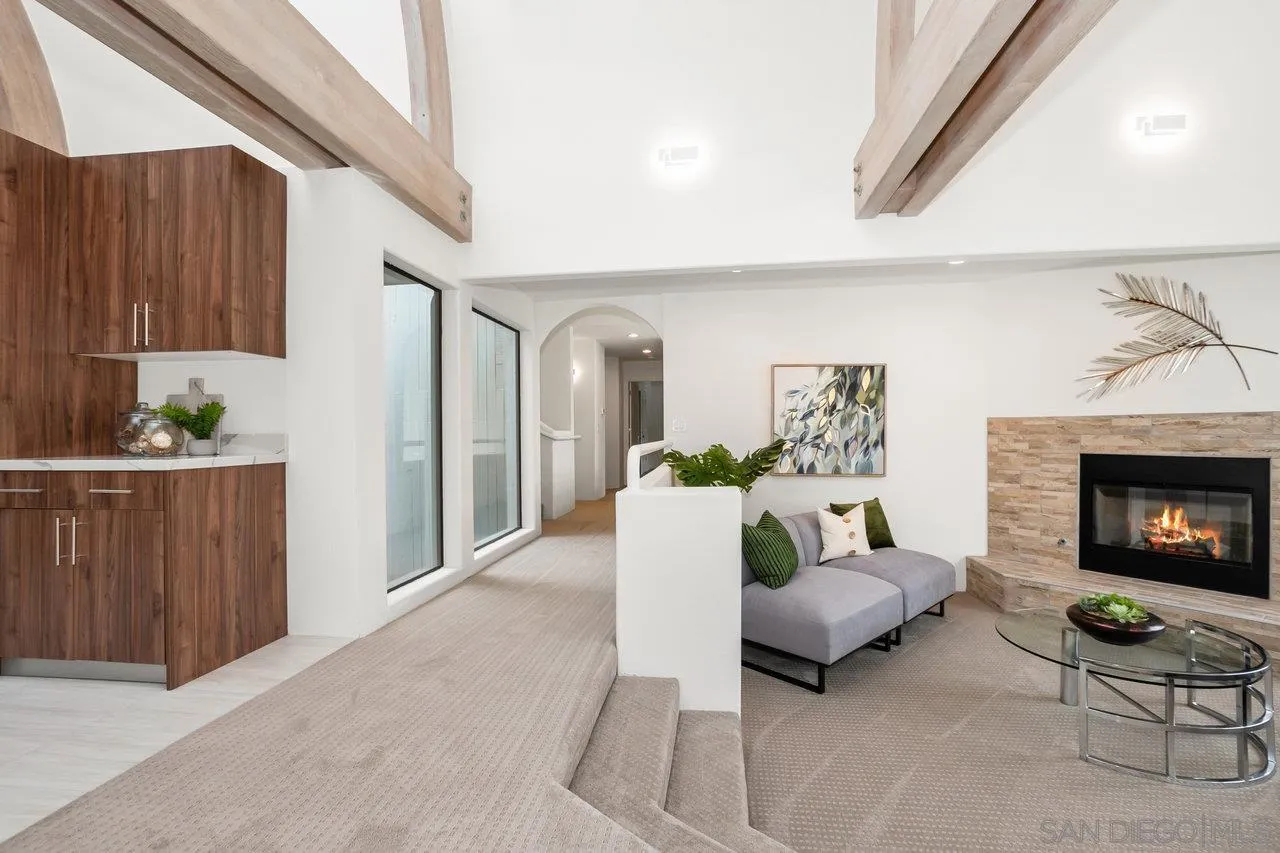 6105 Avenida Chamnez La Jolla, CA 92037 - Photo 11 of 59 a living room with furniture and a fireplace