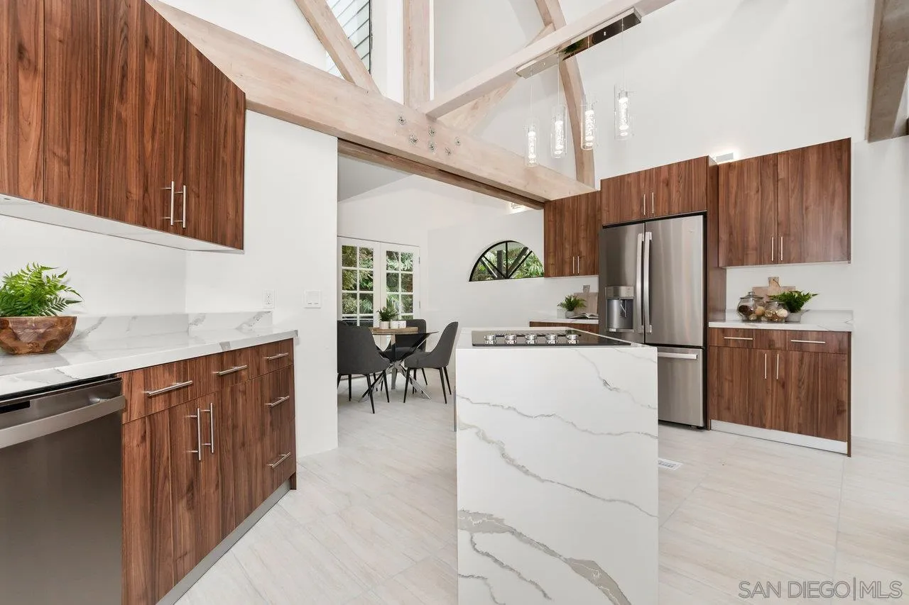 6105 Avenida Chamnez La Jolla, CA 92037 - Photo 12 of 59 a kitchen with refrigerator cabinets and a sink