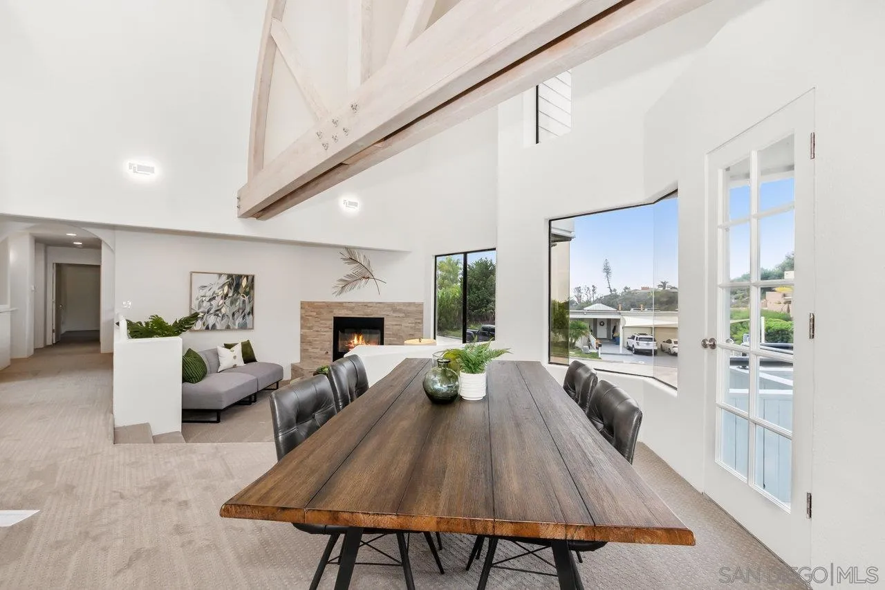 6105 Avenida Chamnez La Jolla, CA 92037 - Photo 16 of 59 a living room with furniture fireplace and a table