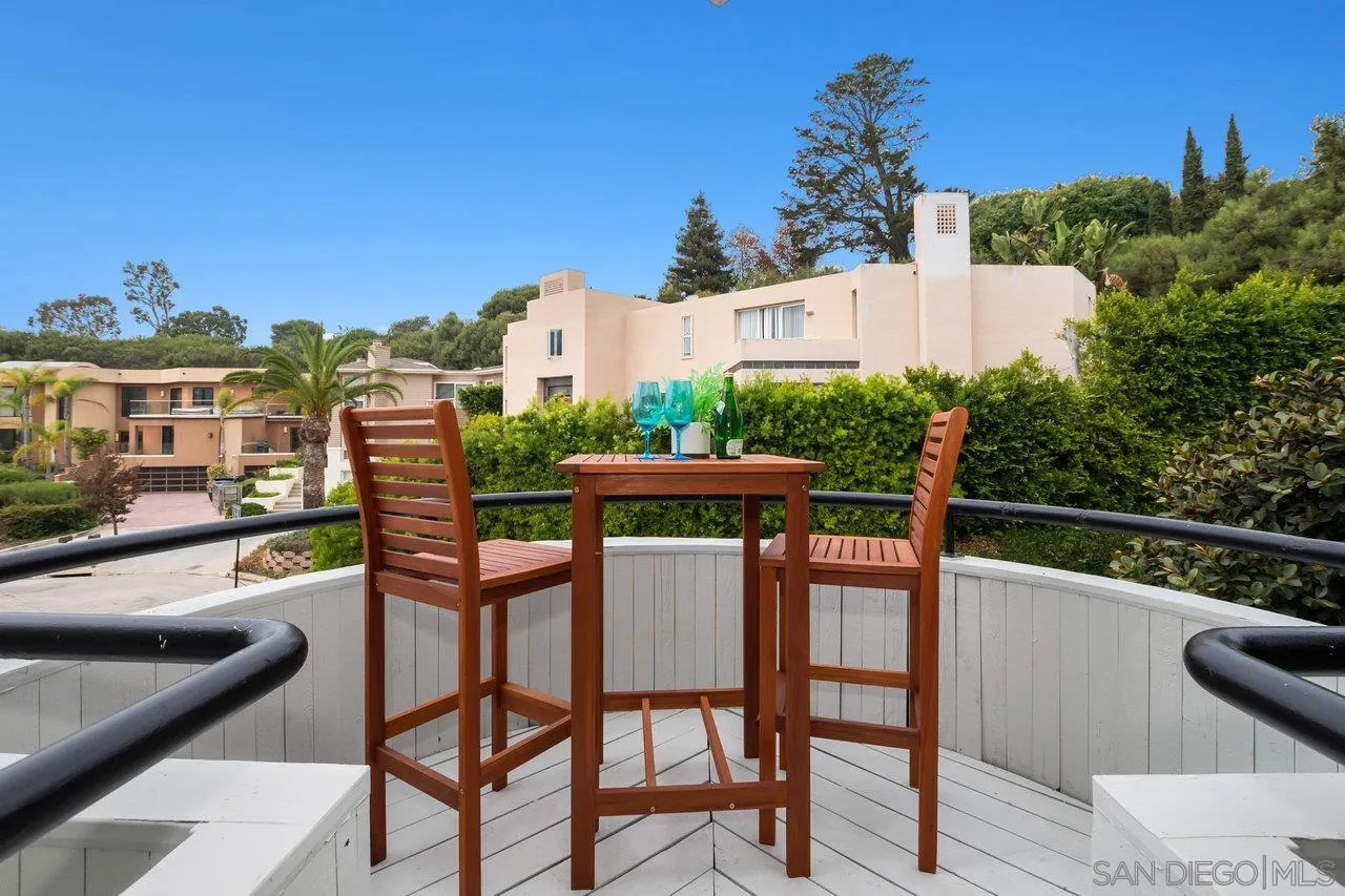 6105 Avenida Chamnez La Jolla, CA 92037 - Photo 17 of 59 a balcony with table and chairs