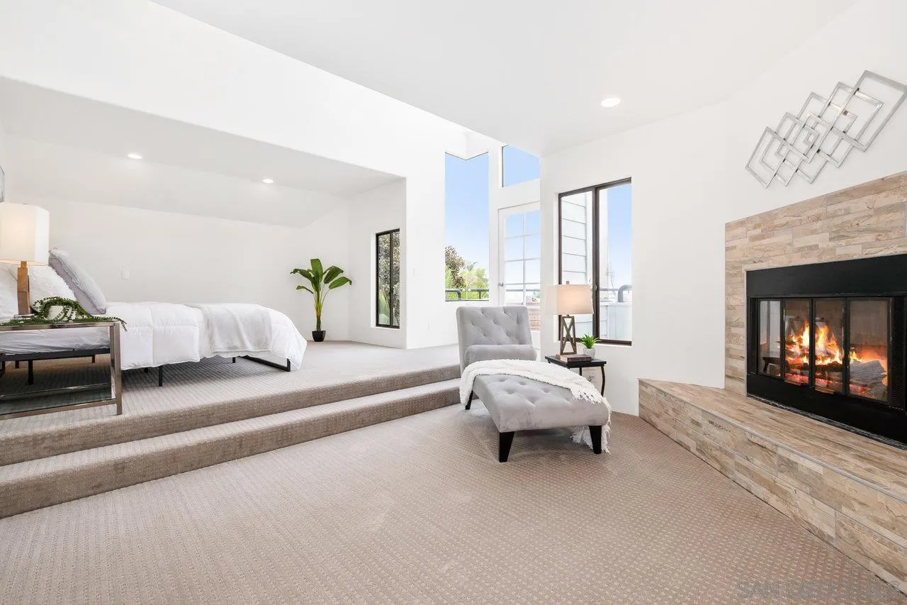 6105 Avenida Chamnez La Jolla, CA 92037 - Photo 26 of 59 a living room with furniture and a fireplace