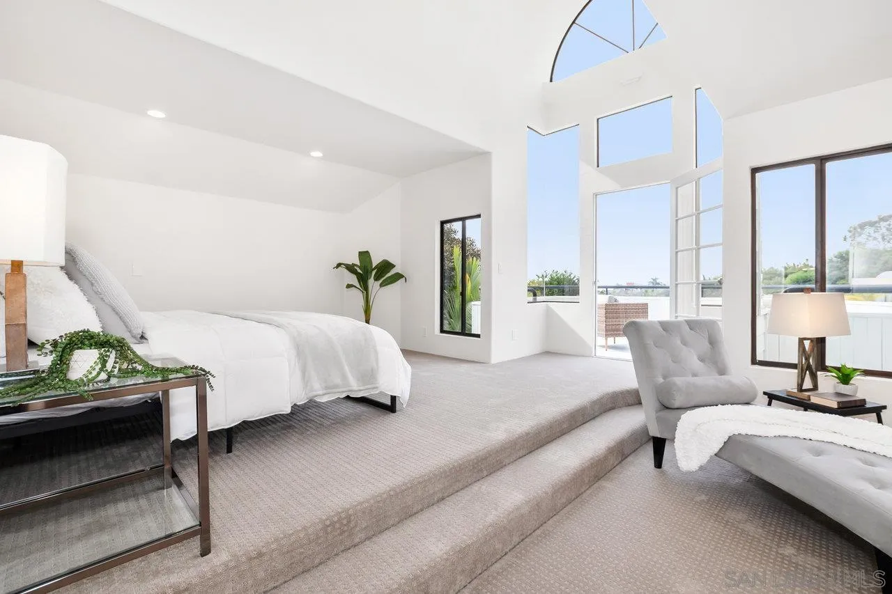 6105 Avenida Chamnez La Jolla, CA 92037 - Photo 29 of 59 a spacious bedroom with a bed and couch