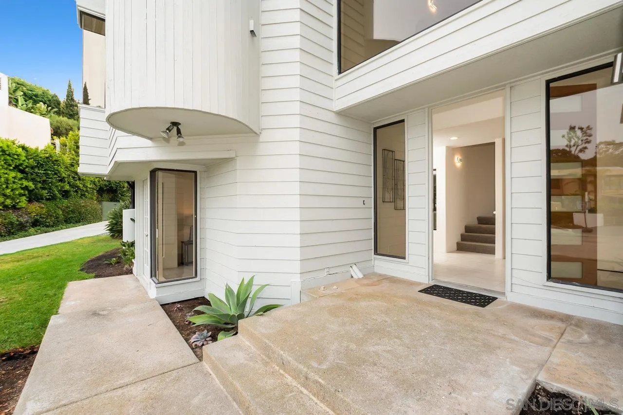 6105 Avenida Chamnez La Jolla, CA 92037 - Photo 3 of 59 a front view of a house with a yard