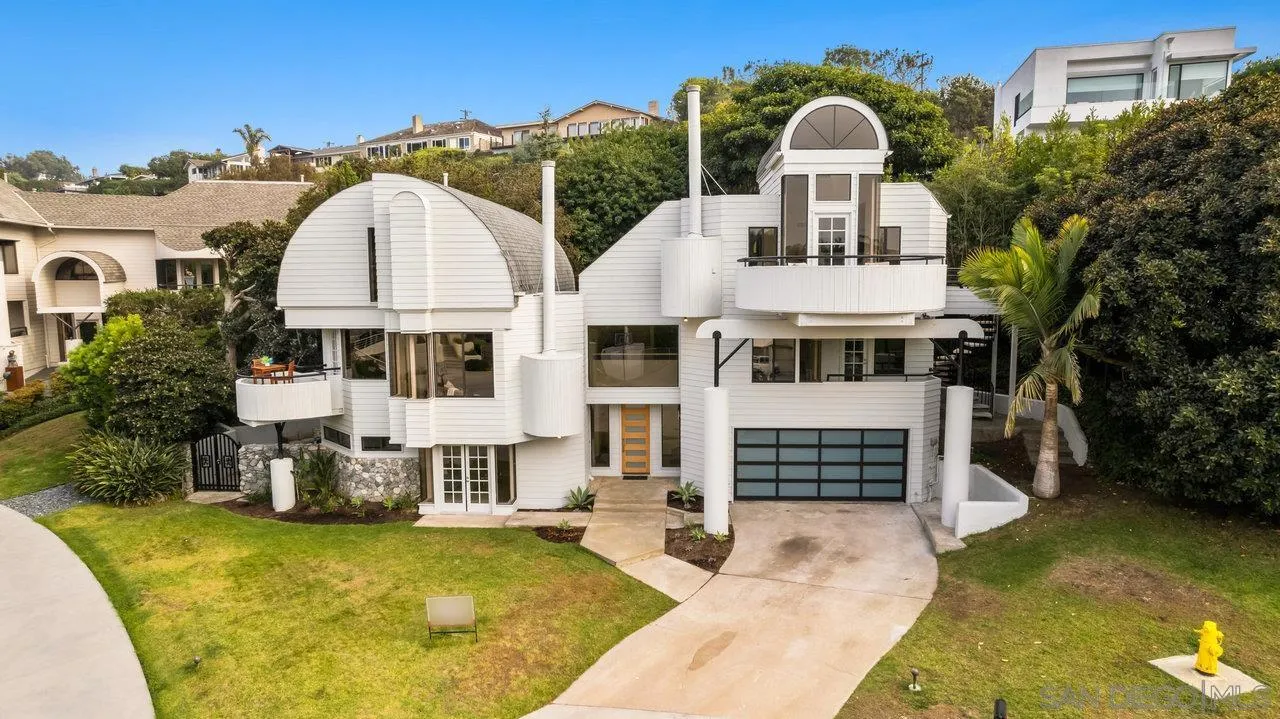 6105 Avenida Chamnez La Jolla, CA 92037 - Photo 44 of 59 a front view of a house with a yard
