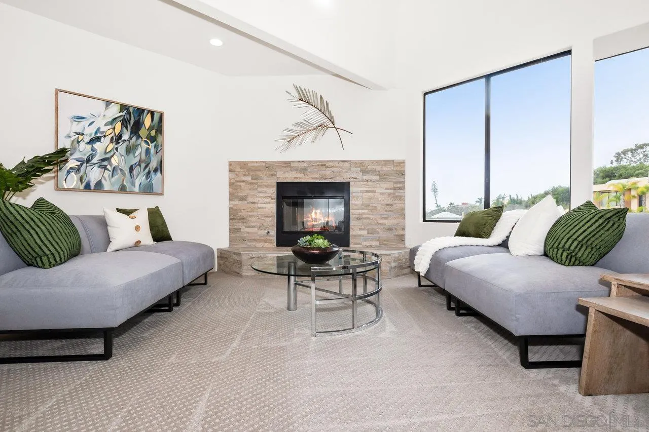 6105 Avenida Chamnez La Jolla, CA 92037 - Photo 5 of 59 a living room with furniture and a fireplace