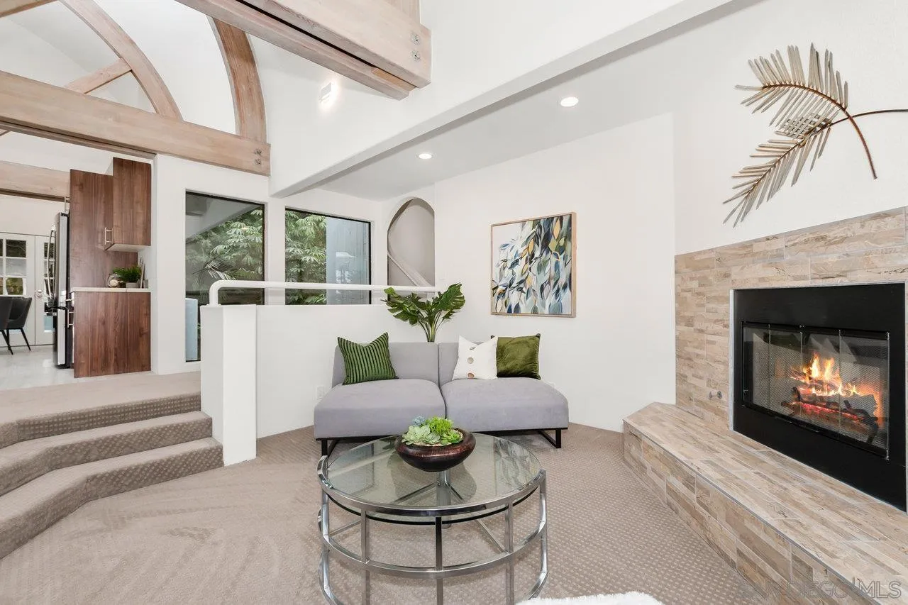 6105 Avenida Chamnez La Jolla, CA 92037 - Photo 6 of 59 a living room with furniture and a fireplace