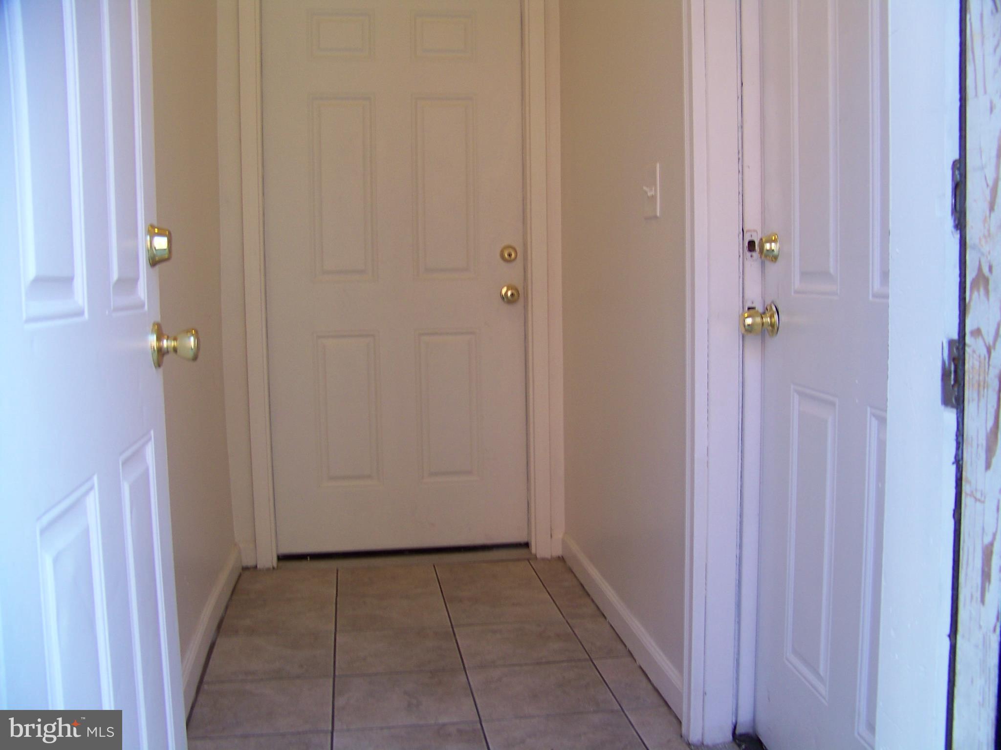 a view of a hallway with closet area