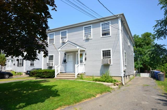 180 Stonybrook Road Stratford, CT 06614 - Photo 1 of 1 a front view of a house with a yard and trees