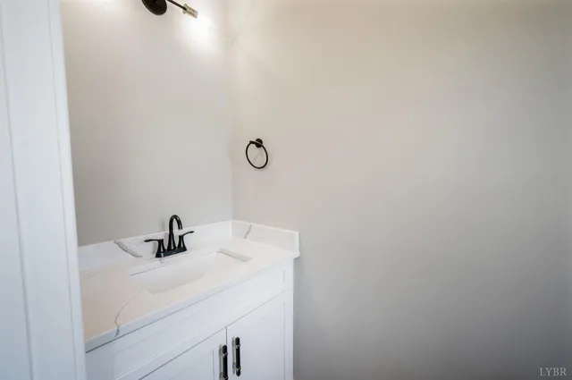 a bathroom with a sink and mirror