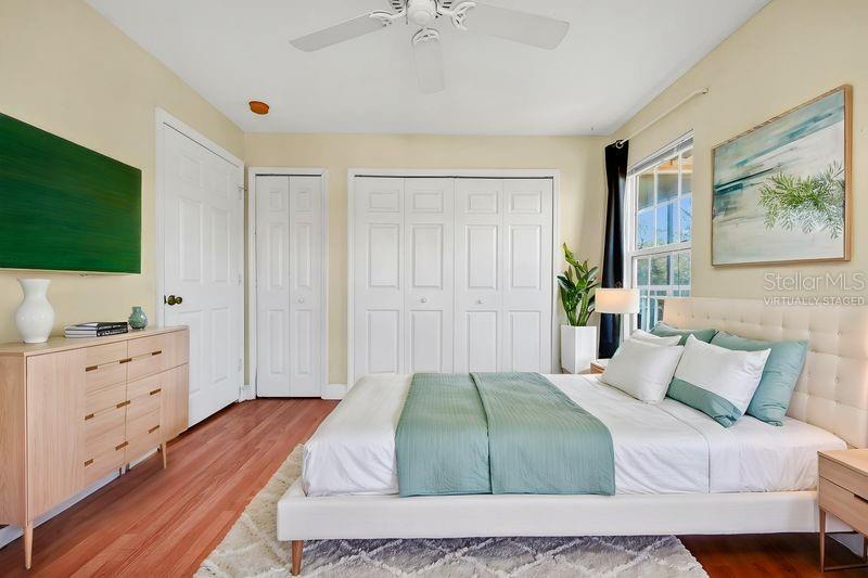 5471 Vineland Road, Unit 7301 Orlando, FL 32811 - Photo 13 of 34 a bedroom with a bed and a flat screen tv