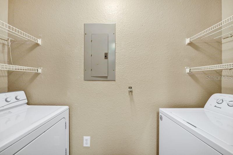 5471 Vineland Road, Unit 7301 Orlando, FL 32811 - Photo 21 of 34 a utility room with dryer and washer