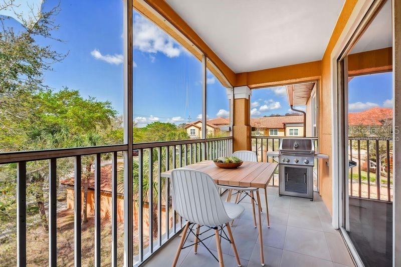 5471 Vineland Road, Unit 7301 Orlando, FL 32811 - Photo 23 of 34 a view of a balcony with chairs