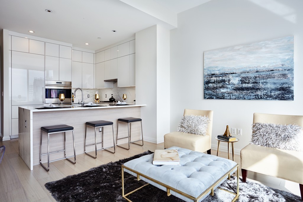 1 Franklin Street, Unit 3409 Boston, MA 02110 - Photo 2 of 18 a living room with stainless steel appliances kitchen island granite countertop furniture and a view of kitchen