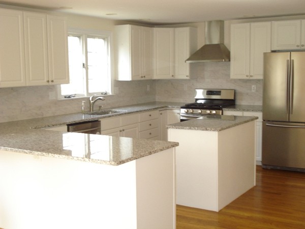 344 Weston Road Wellesley, MA 02482 - Photo 3 of 10 a kitchen with stainless steel appliances granite countertop a sink a refrigerator a stove a microwave and cabinets