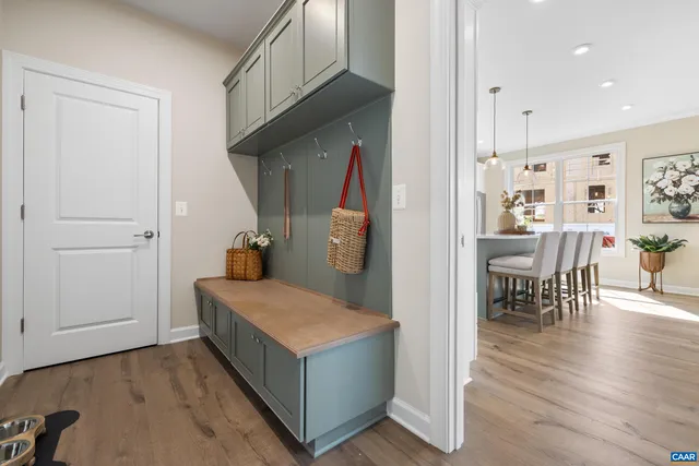 a view of kitchen island with furniture and wooden floor