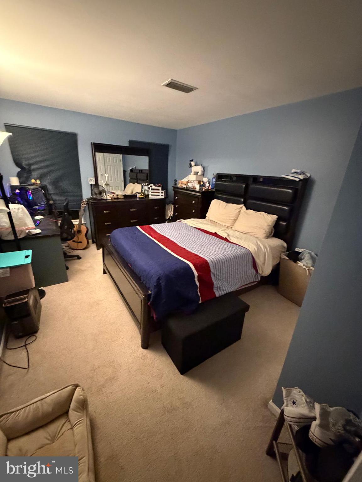 9300 Nancy Street Manassas Park, VA 20111 - Photo 14 of 22 a spacious bedroom with a bed and a couch