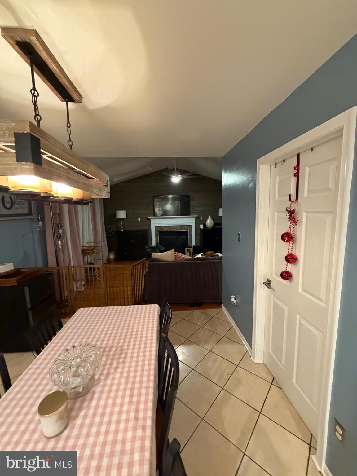 9300 Nancy Street Manassas Park, VA 20111 - Photo 9 of 22 a kitchen with stainless steel appliances kitchen island a refrigerator sink and cabinets