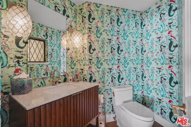 a view of staircase with white walls and railing