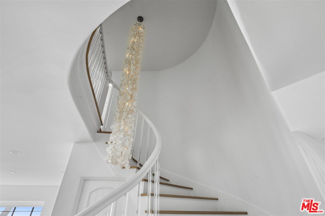 31500 Victoria Point Road Malibu, CA 90265 - Photo 20 of 53 a view of staircase with white walls and railing