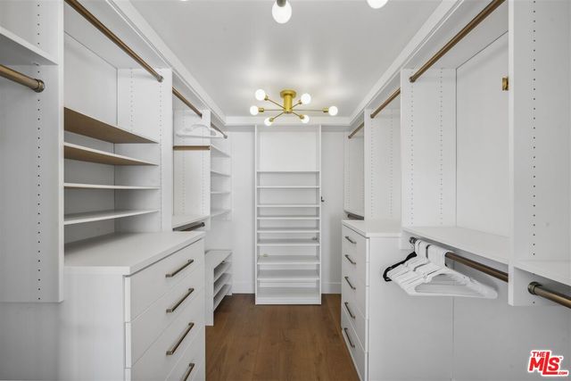 a bathroom with a sink vanity and mirror