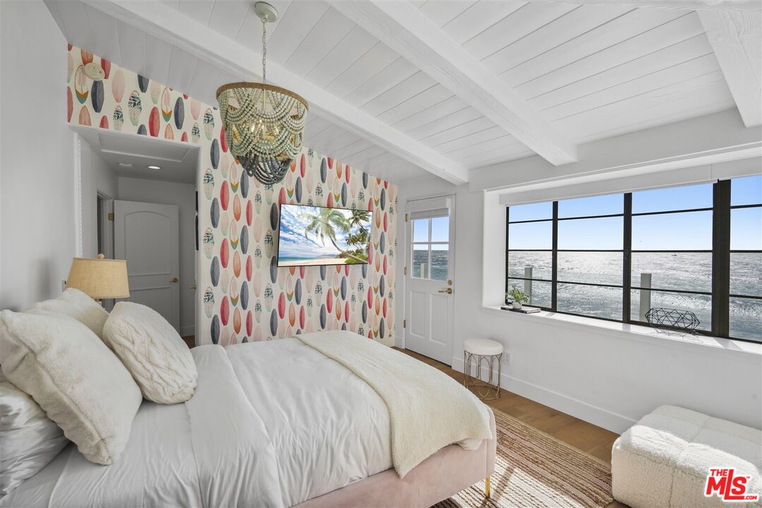 31500 Victoria Point Road Malibu, CA 90265 - Photo 31 of 53 a bedroom with a bed and a window