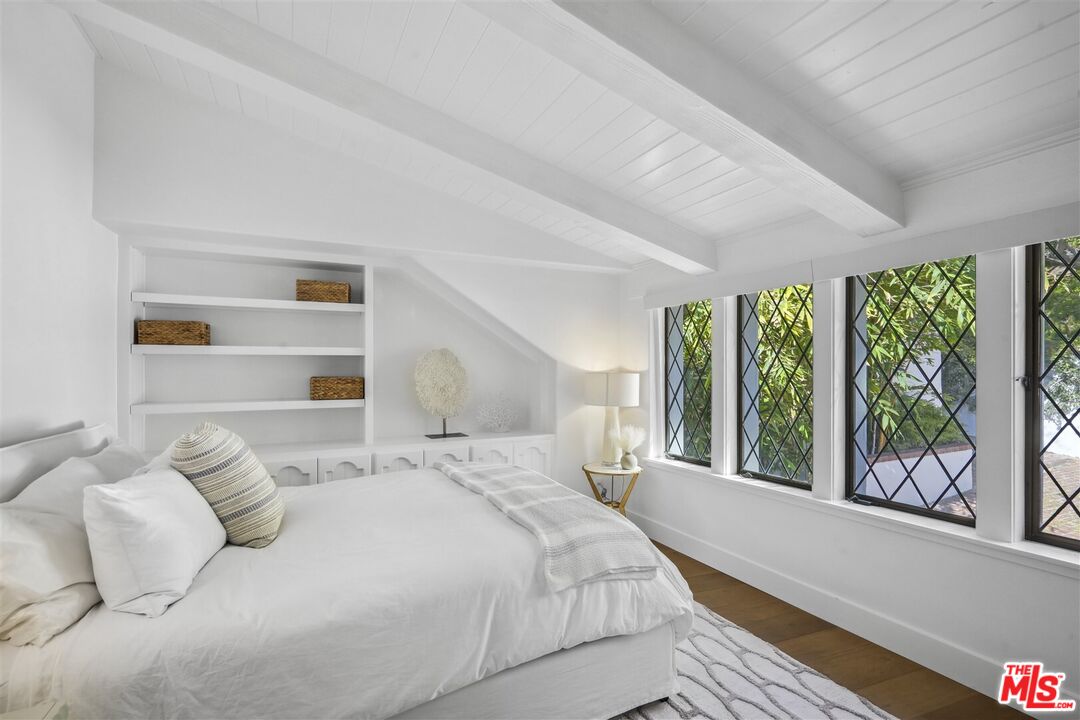 31500 Victoria Point Road Malibu, CA 90265 - Photo 35 of 53 a bedroom with a large bed and a large window