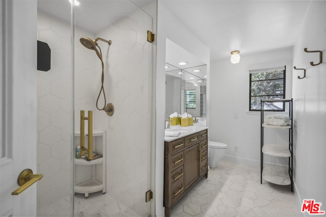 31500 Victoria Point Road Malibu, CA 90265 - Photo 37 of 53 a bathroom with a sink a toilet and shower