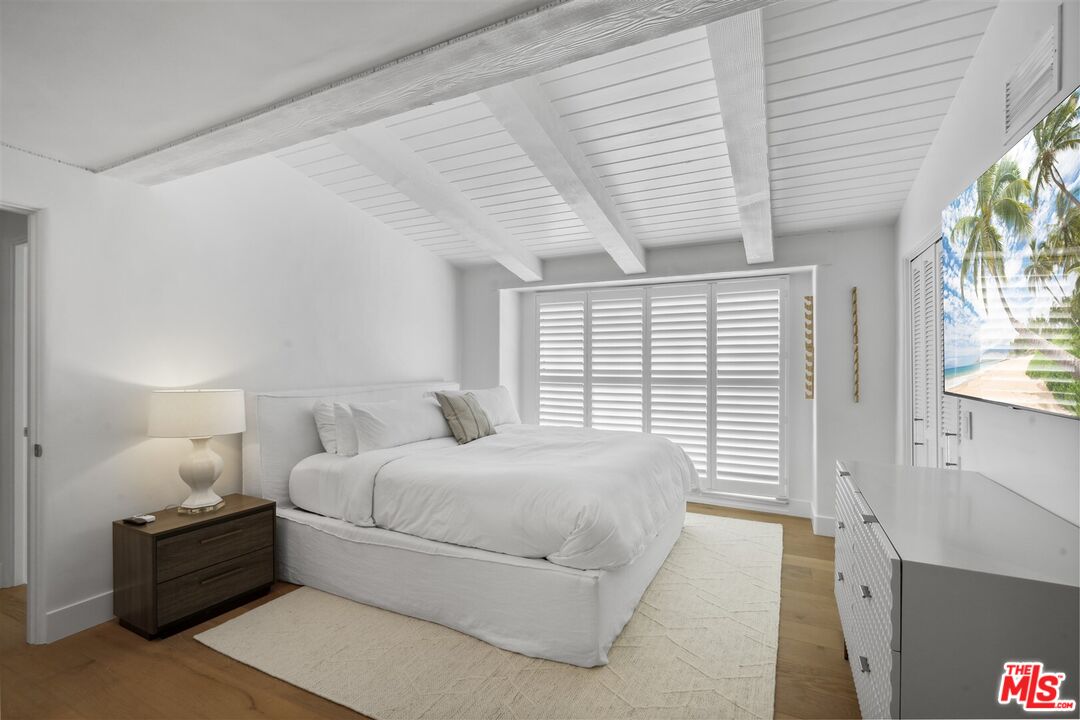31500 Victoria Point Road Malibu, CA 90265 - Photo 40 of 53 a bedroom with a bed and a large window