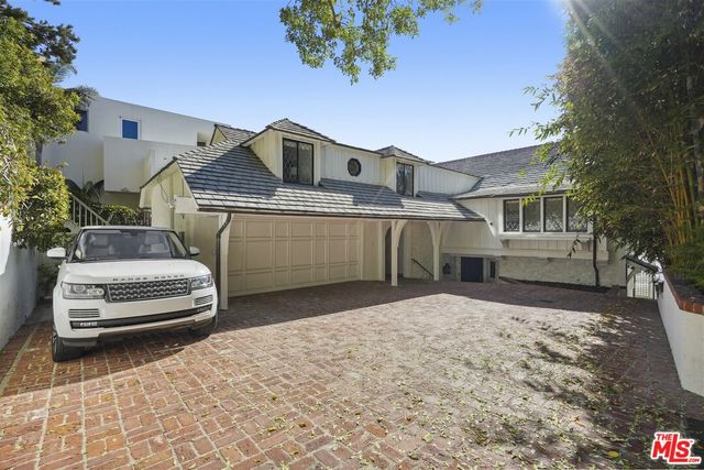 a view of a pathway with a tree