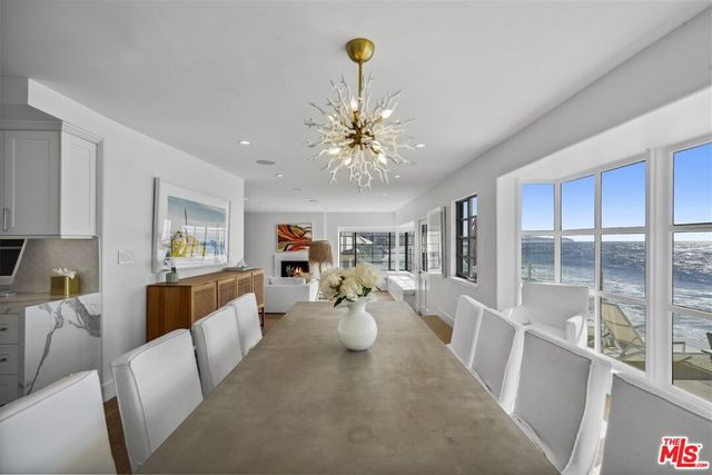 a view of living room with furniture and chandelier