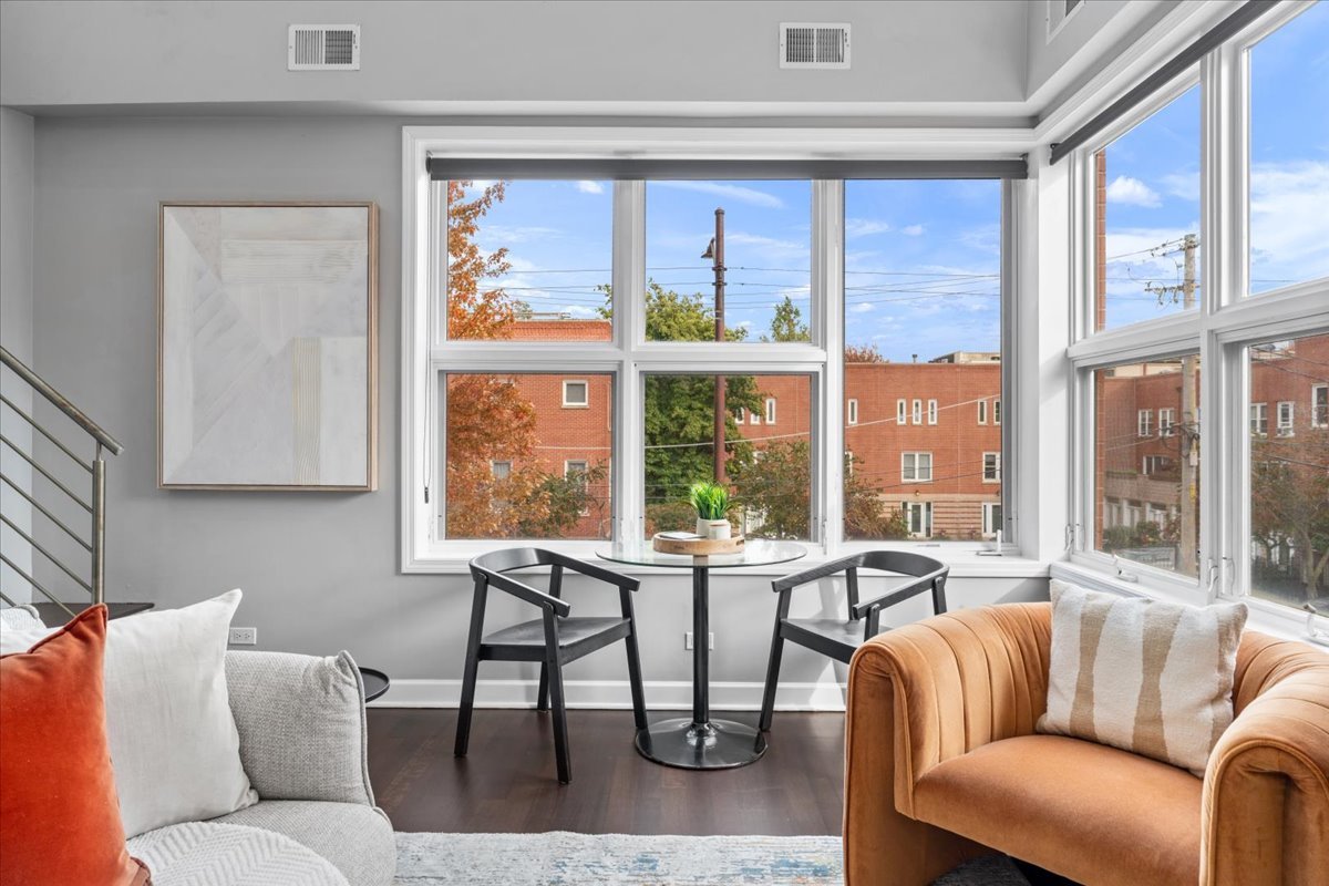 932 North Racine Avenue, Unit 2S Chicago, IL 60642 - Photo 12 of 29 a living room with furniture and a large window