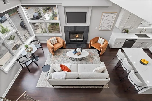 a living room with furniture and a fireplace