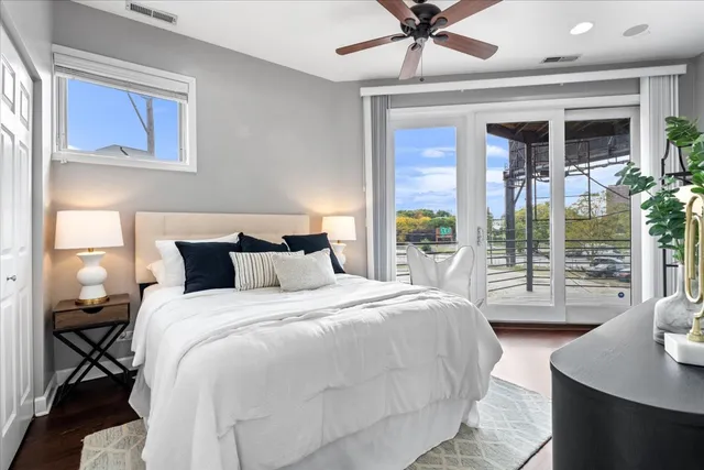 a bedroom with a large bed and a window