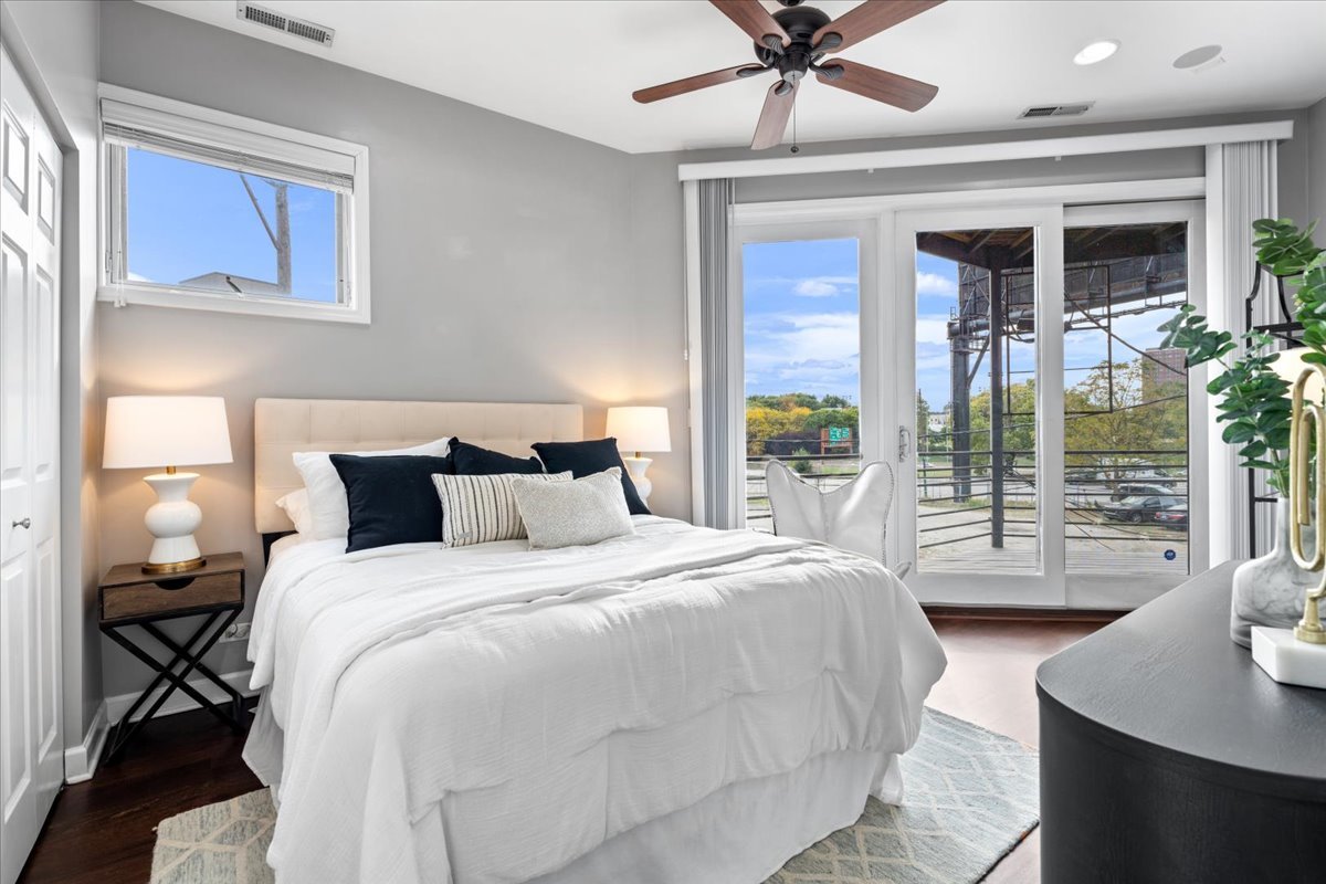 932 North Racine Avenue, Unit 2S Chicago, IL 60642 - Photo 20 of 29 a bedroom with a large bed and a window