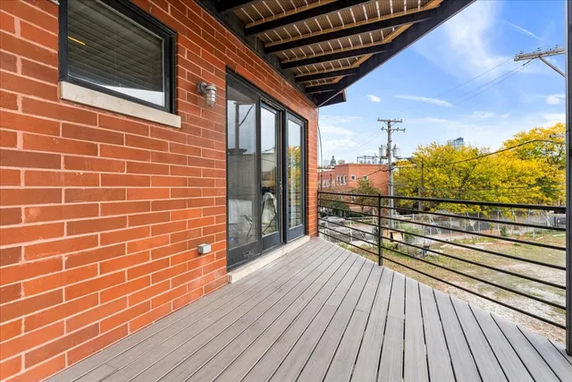 a view of a balcony with wooden floor