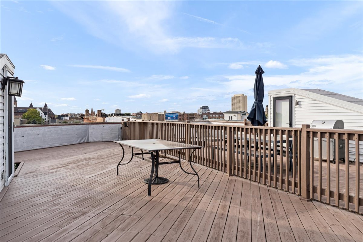 932 North Racine Avenue, Unit 2S Chicago, IL 60642 - Photo 27 of 29 a view of a terrace with chairs