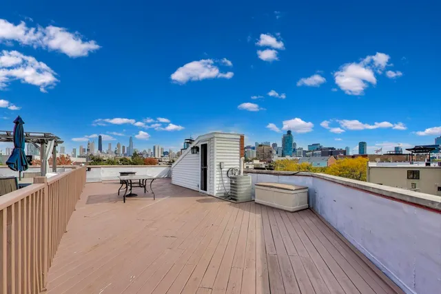 a view of a terrace with furniture and a kitchen