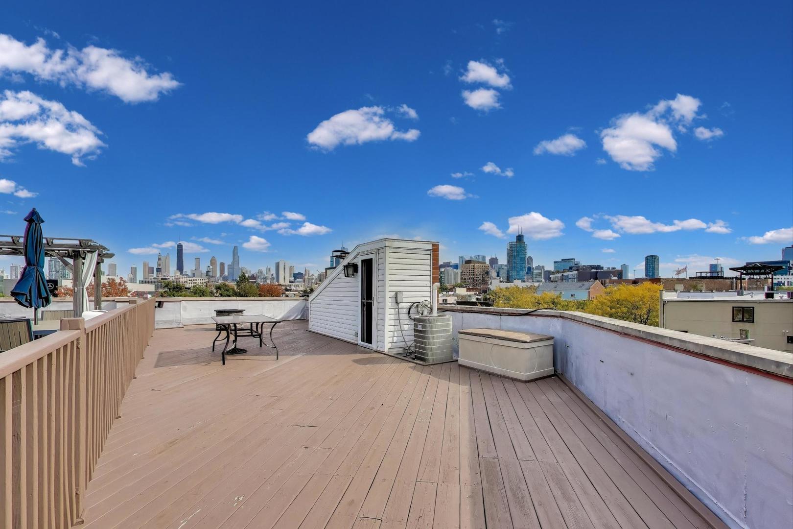 932 North Racine Avenue, Unit 2S Chicago, IL 60642 - Photo 28 of 29 a view of a terrace with furniture and a kitchen