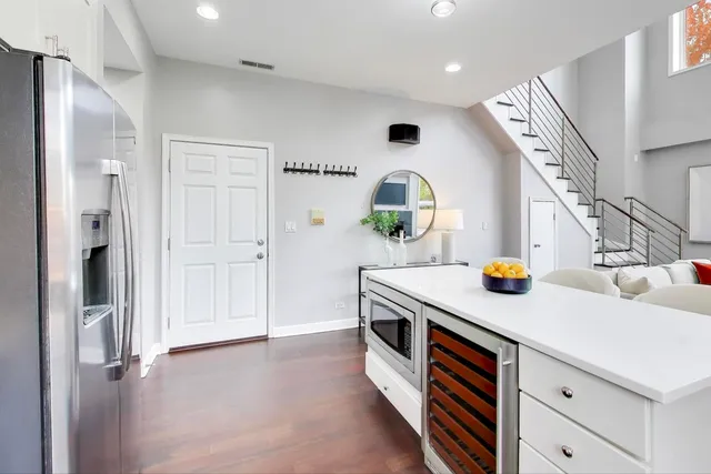 a kitchen view with stainless steel appliances a sink dishwasher stove and refrigerator